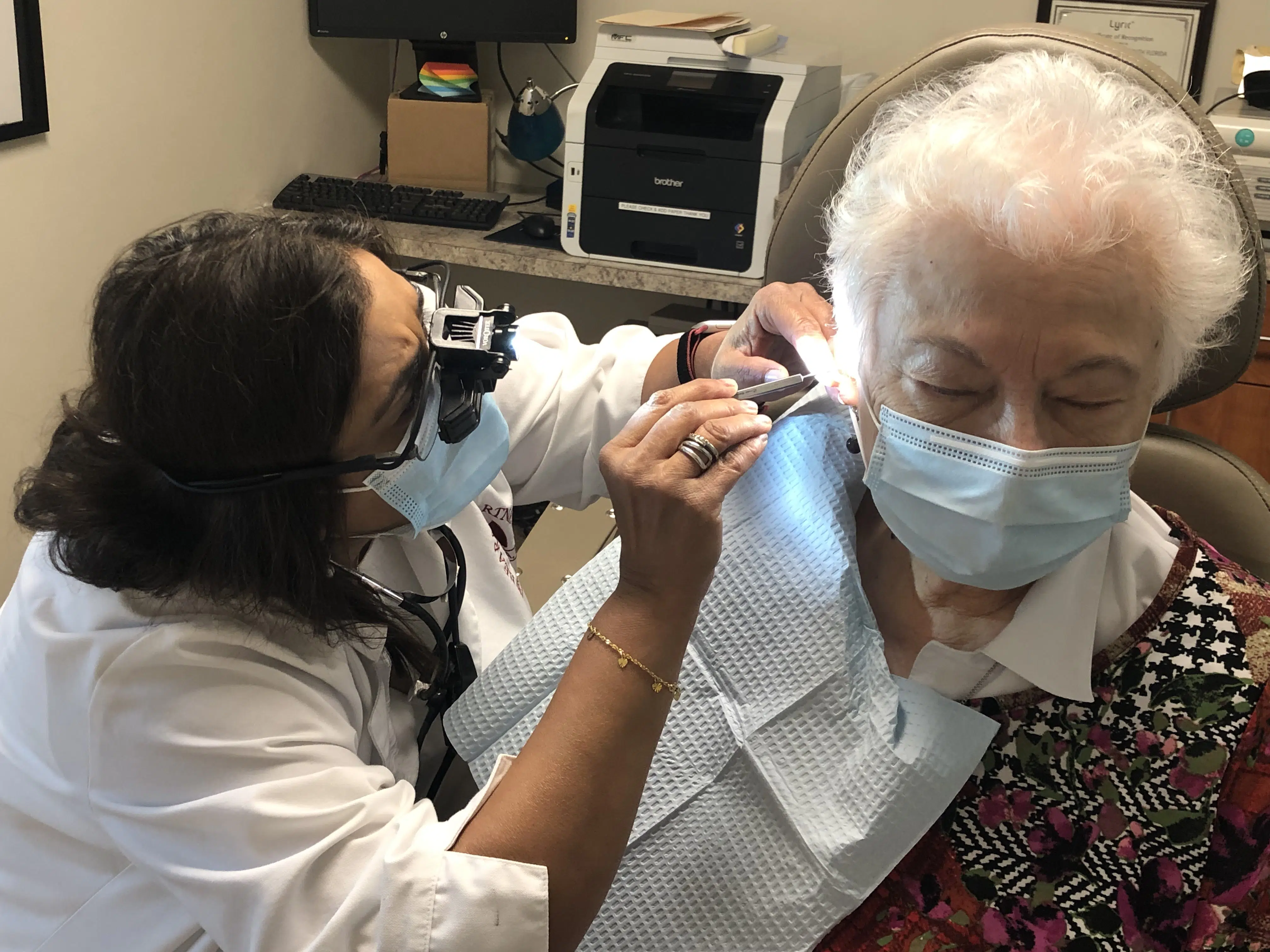 Audiologist Removing Earwax